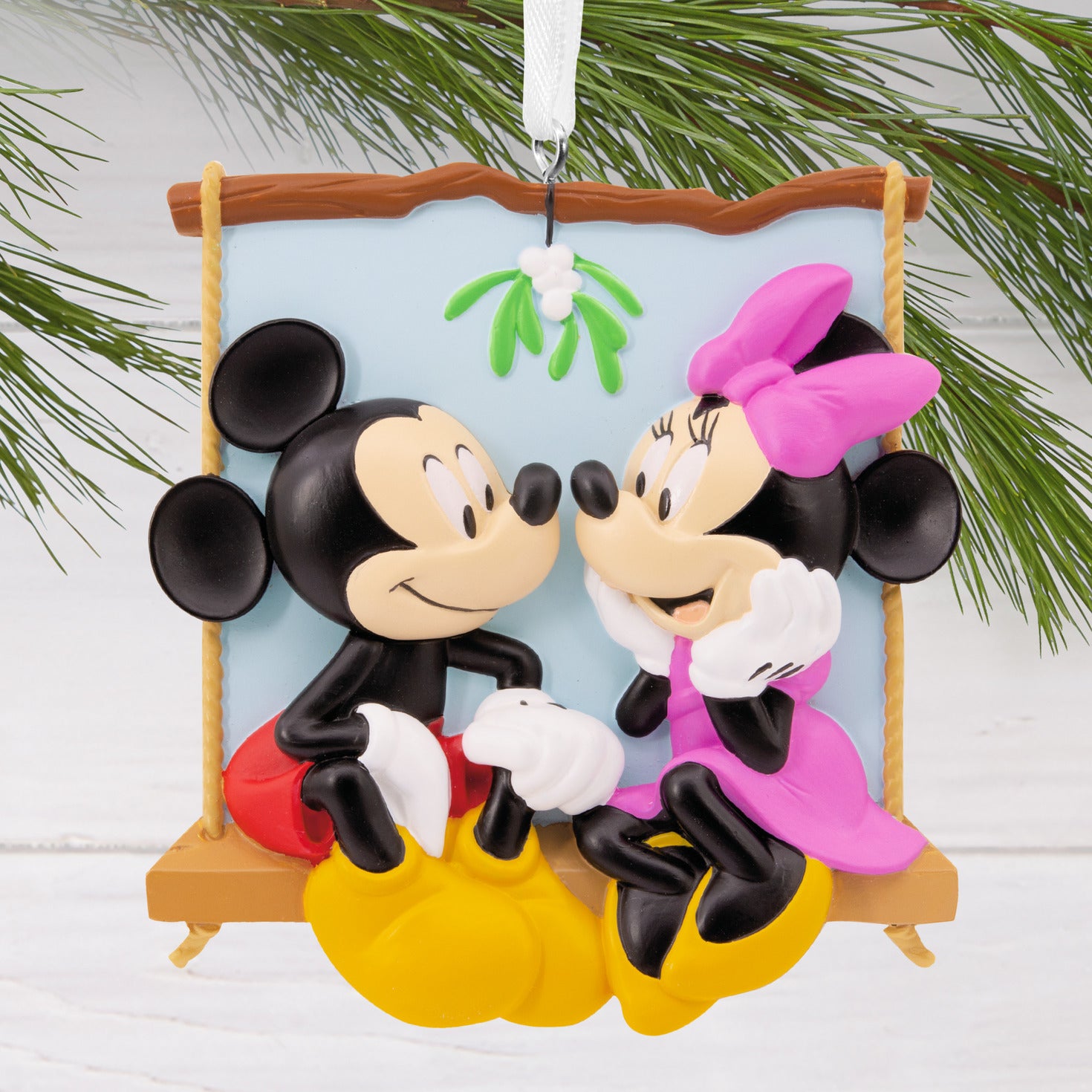 Hallmark Christmas ornament - Disney Mickey and Minnie on swing, colourful design with mistletoe, detailed close up view