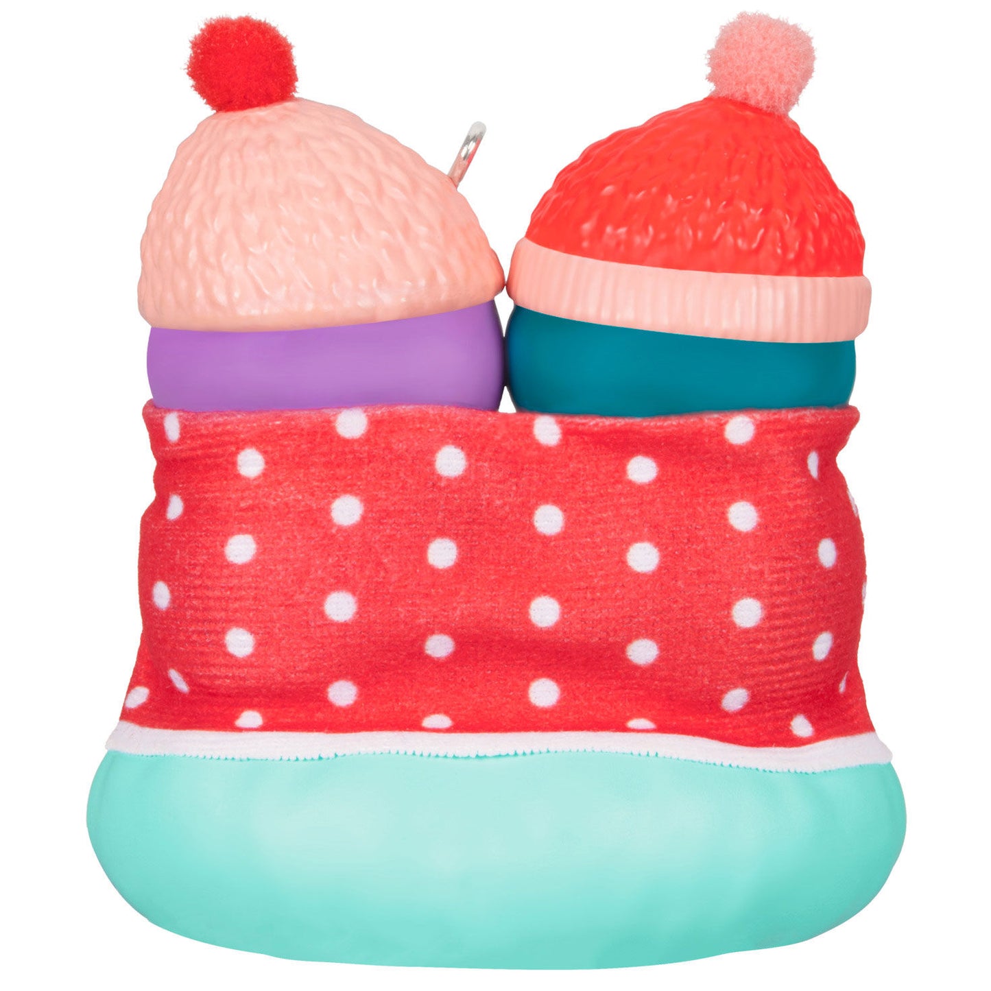 Sisters Warm Our Hearts — Hallmark Keepsake Christmas Ornament featuring two penguin figures in a polka dot blanket, top view.