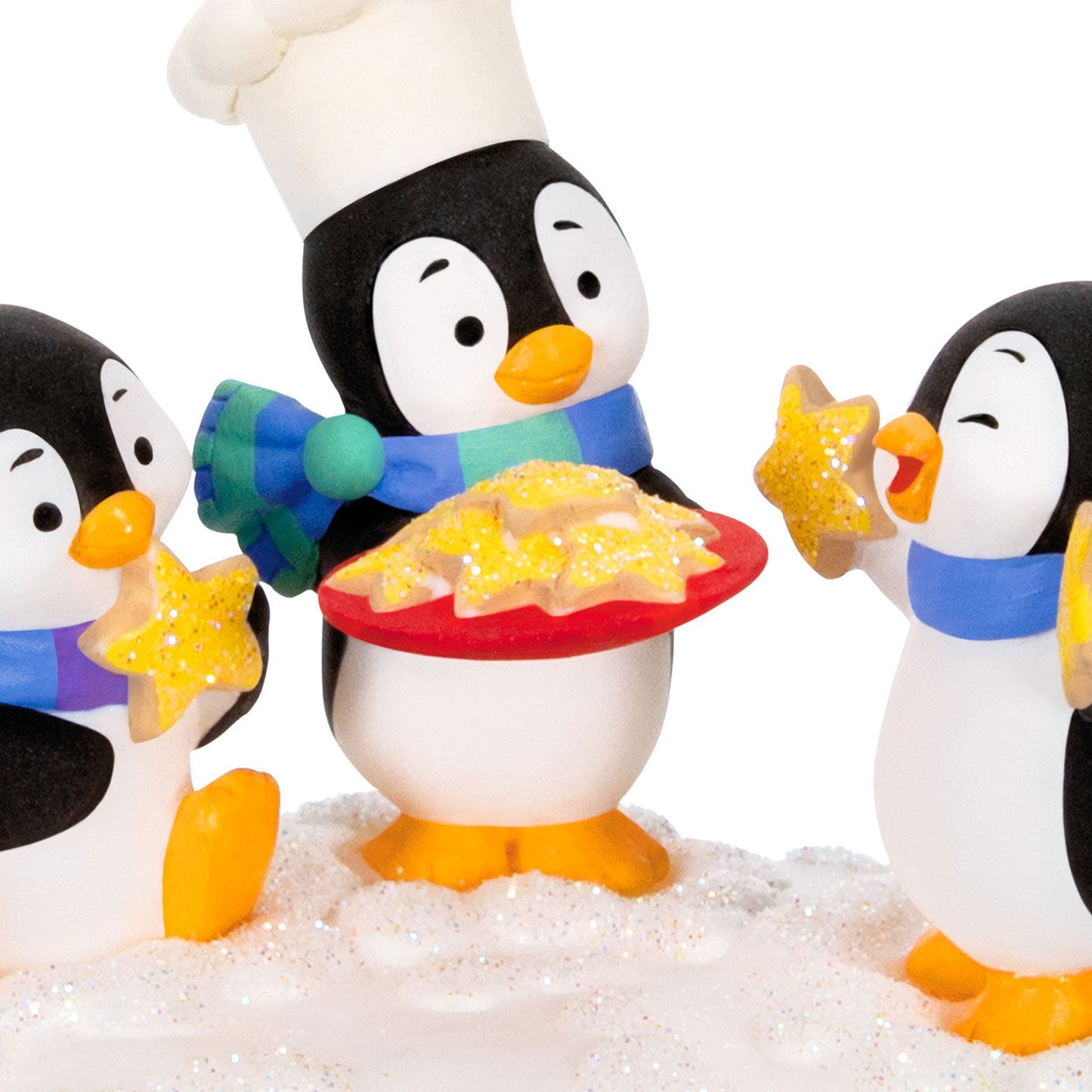 Cookie Exchange — Hallmark Keepsake Christmas Ornament featuring playful penguins with a chef hat sharing star-shaped cookies on a snowy base.
