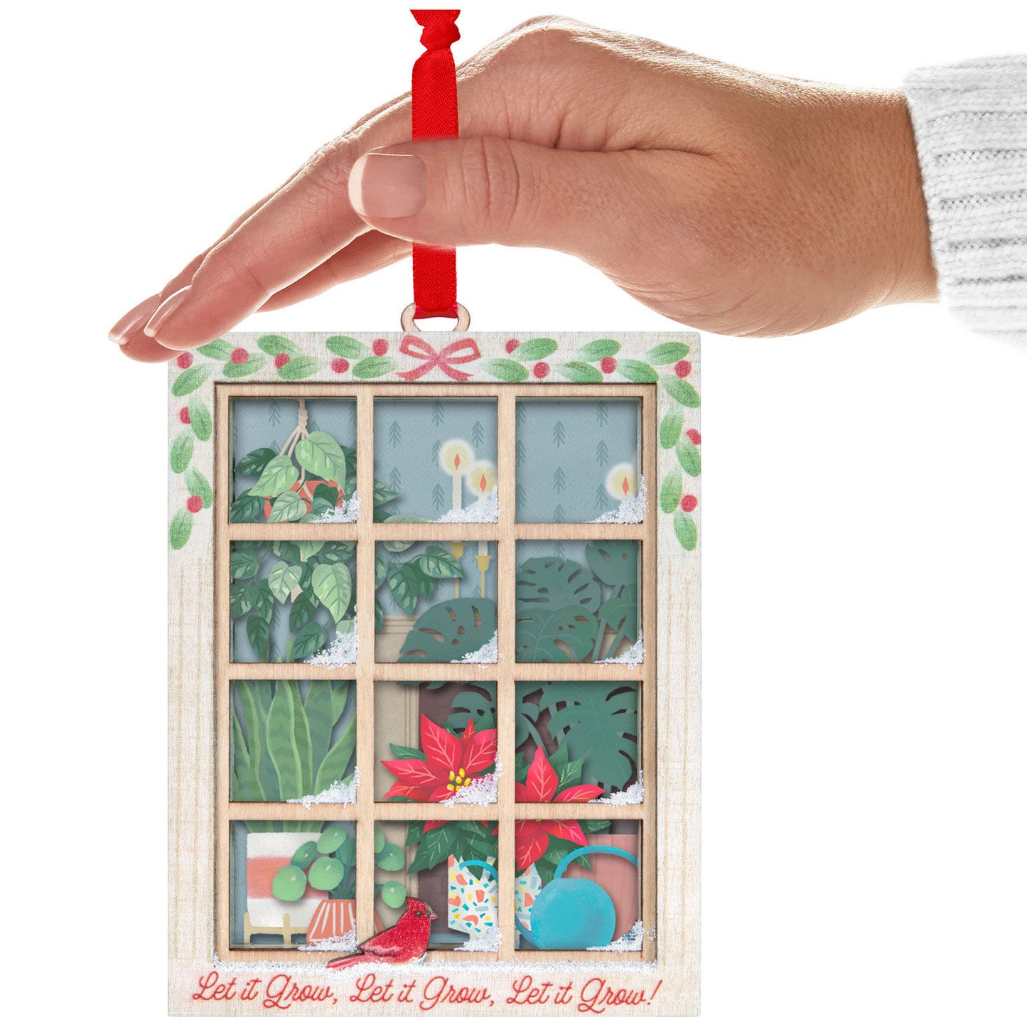 Let It Grow! Papercraft — Hallmark Keepsake Christmas Ornament hanging from a hand, featuring intricate plant details and festive decor.