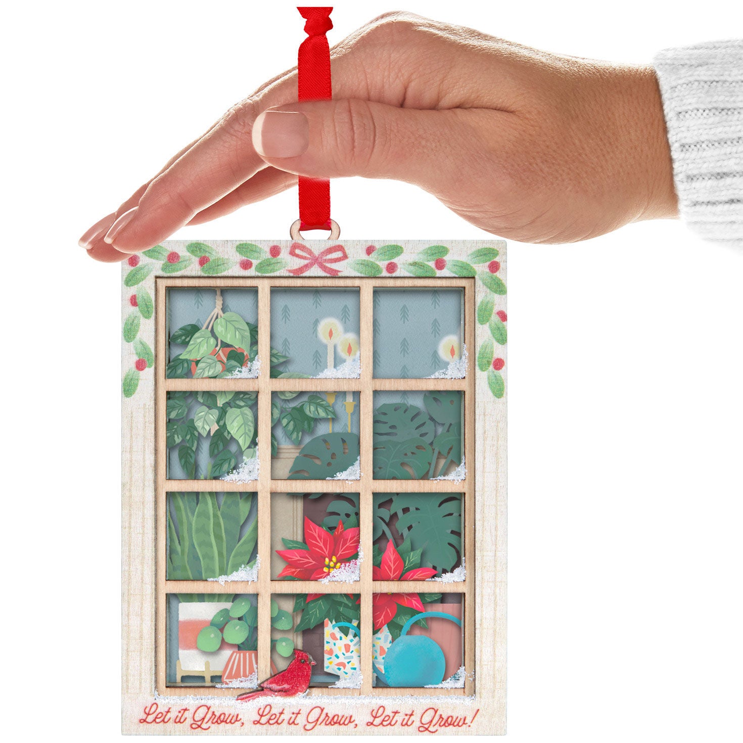 Let It Grow! Papercraft — Hallmark Keepsake Christmas Ornament hanging from a hand, featuring intricate plant details and festive decor.