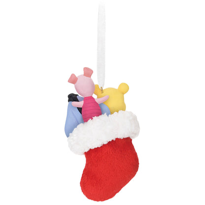 Disney Winnie the Pooh, A Snuggly First Christmas — Hallmark Keepsake Christmas Ornament featuring Pooh, Piglet, and Eeyore in a plush stocking.