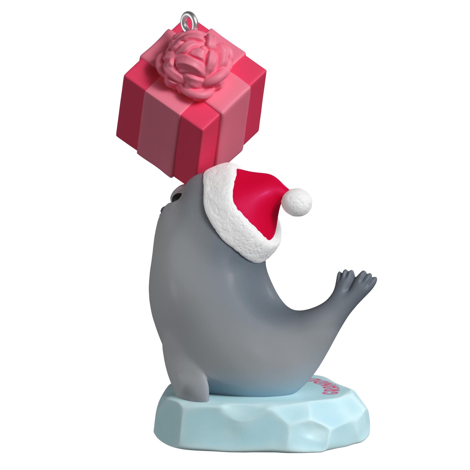 Granddaughter — 2025 Hallmark Keepsake Christmas Ornament featuring a grey seal in a Santa hat balancing a pink gift on its nose.