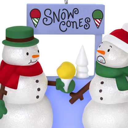 A Snowy Surprise — 2025 Hallmark Keepsake Christmas Ornament featuring two snowmen at a snow cone stand, one in surprise, holding a yellow snow cone.