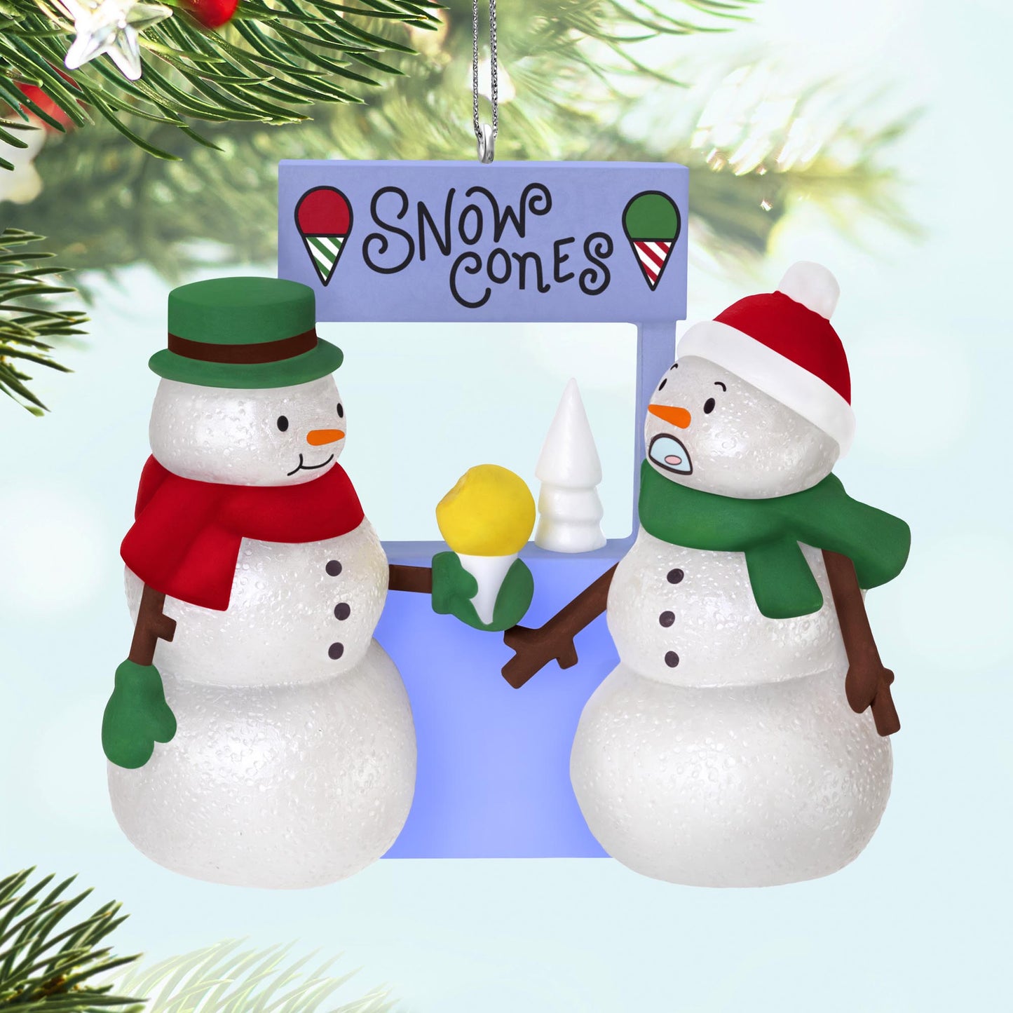 A Snowy Surprise — 2025 Hallmark Keepsake Christmas Ornament featuring playful snowmen sharing a snow cone at a vibrant stand.