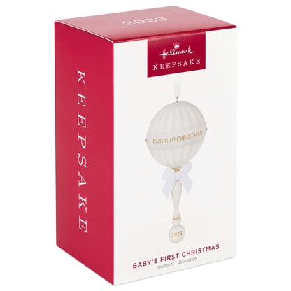 Baby's First Christmas (2023) porcelain rattle — Hallmark Keepsake Christmas ornament packaging with decorative design.