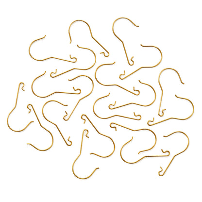 Hallmark Keepsake Christmas Ornament Hooks (Brass, Metal), Set of 20, close up view of gold-colour metal hooks arranged on a flat surface.