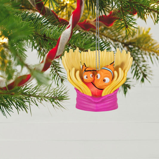Disney/Pixar Finding Nemo 20th Anniversary, Marlin & Nemo — Hallmark Keepsake Christmas Ornament in bright colours, suspended among Christmas tree branches.