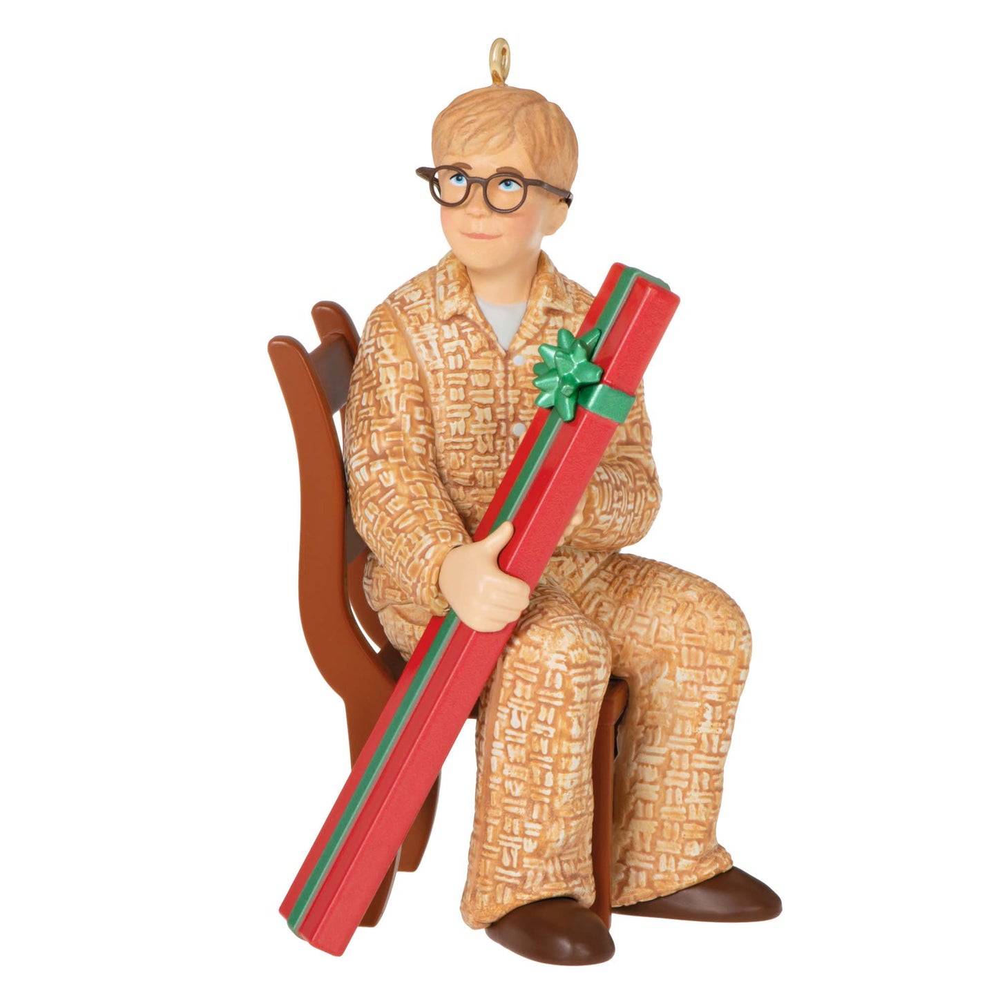 Coveted Gift, A Christmas Story 40th Anniversary — Hallmark Keepsake Christmas Ornament, detailed figurine of Ralphie in pyjamas, holding a large gift.