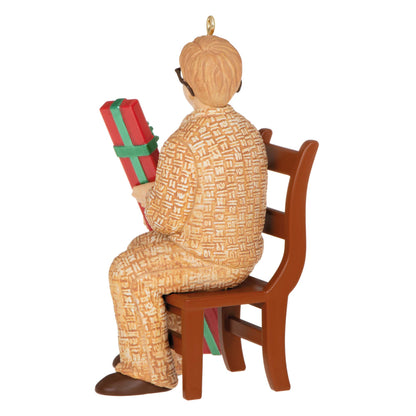 Coveted Gift, A Christmas Story 40th Anniversary - Hallmark Keepsake Christmas Ornament, detailed figure sitting on a chair holding a gift.