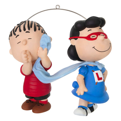 The Peanuts® Gang, Super Lucy and Linus — Hallmark Keepsake Christmas Ornament featuring Lucy in a blue dress with Linus' blue blanket as a cape.