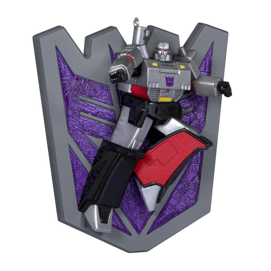 Transformers™, Megatron's Might — 2025 Hallmark Keepsake Christmas Ornament featuring a detailed Megatron figurine in action pose against a Decepticon shield.