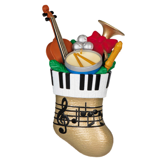 Stocking Stuffers — Hallmark Keepsake Christmas Ornament, gold stocking filled with musical instruments, angled view showcasing details.