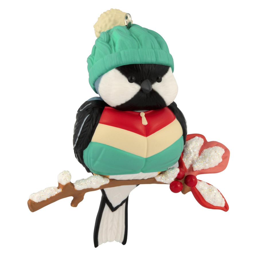 Cozy Critters, 9th in the Series — 2025 Hallmark Keepsake Christmas Ornament, cute black-capped chickadee wearing a teal hat and puffy vest on a snow-dusted holly branch.