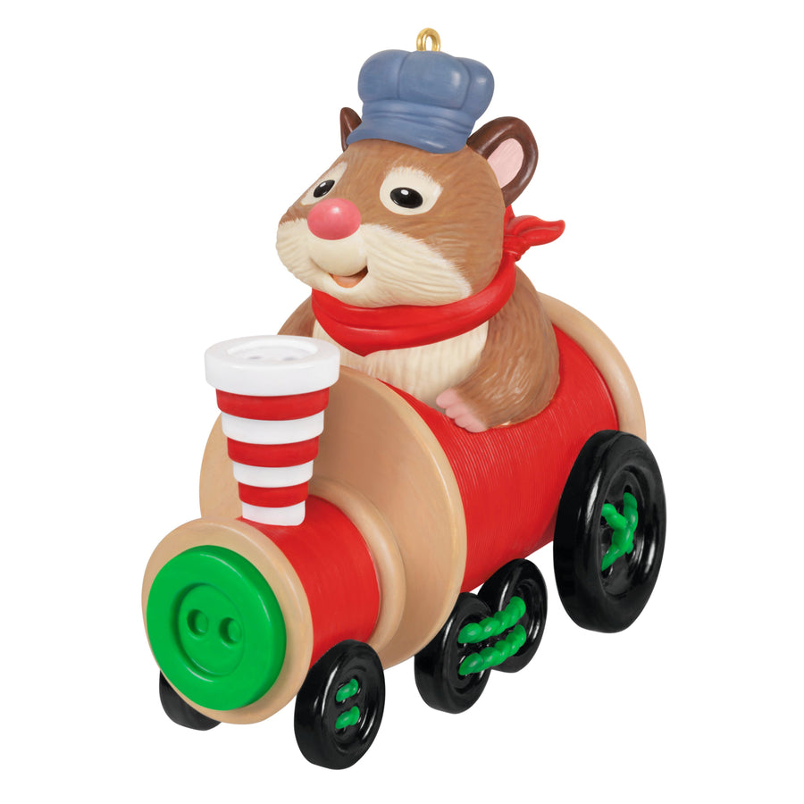Cute as a Button, 3rd in the Series — 2025 Hallmark Keepsake Christmas Ornament featuring a happy hamster driving a colourful train engine, front view.