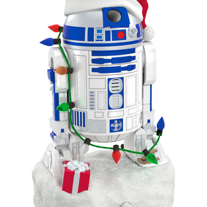 Star Wars™ Decked-Out Droid Musical — 2026 Hallmark Keepsake Christmas Ornament featuring R2-D2 in a Santa hat with Christmas lights on a snow base.