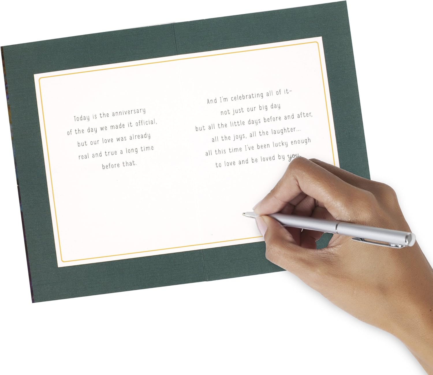 Hallmark Our Anniversary Card Celebrating us Love, Celebrating us (499RZB1025) opened with a hand writing a personal message in pen.