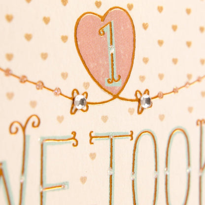 Hallmark 1st Anniversary Card (Chance on What Could Be) close up of glitter accent and hand lettering in pink and gold design