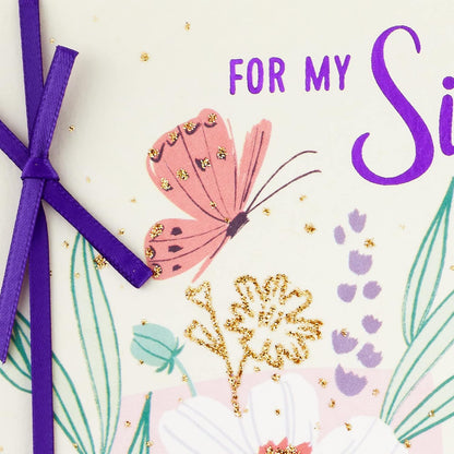 Hallmark Birthday Card for Sister (Life is a Gift) featuring a butterfly, gold accents, and a purple ribbon detail in a close-up view.