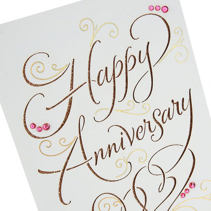 Hallmark Signature Anniversary Card for Couple (Happy Anniversary) with gold foil and pink gemstone accents, close-up on glittery lettering