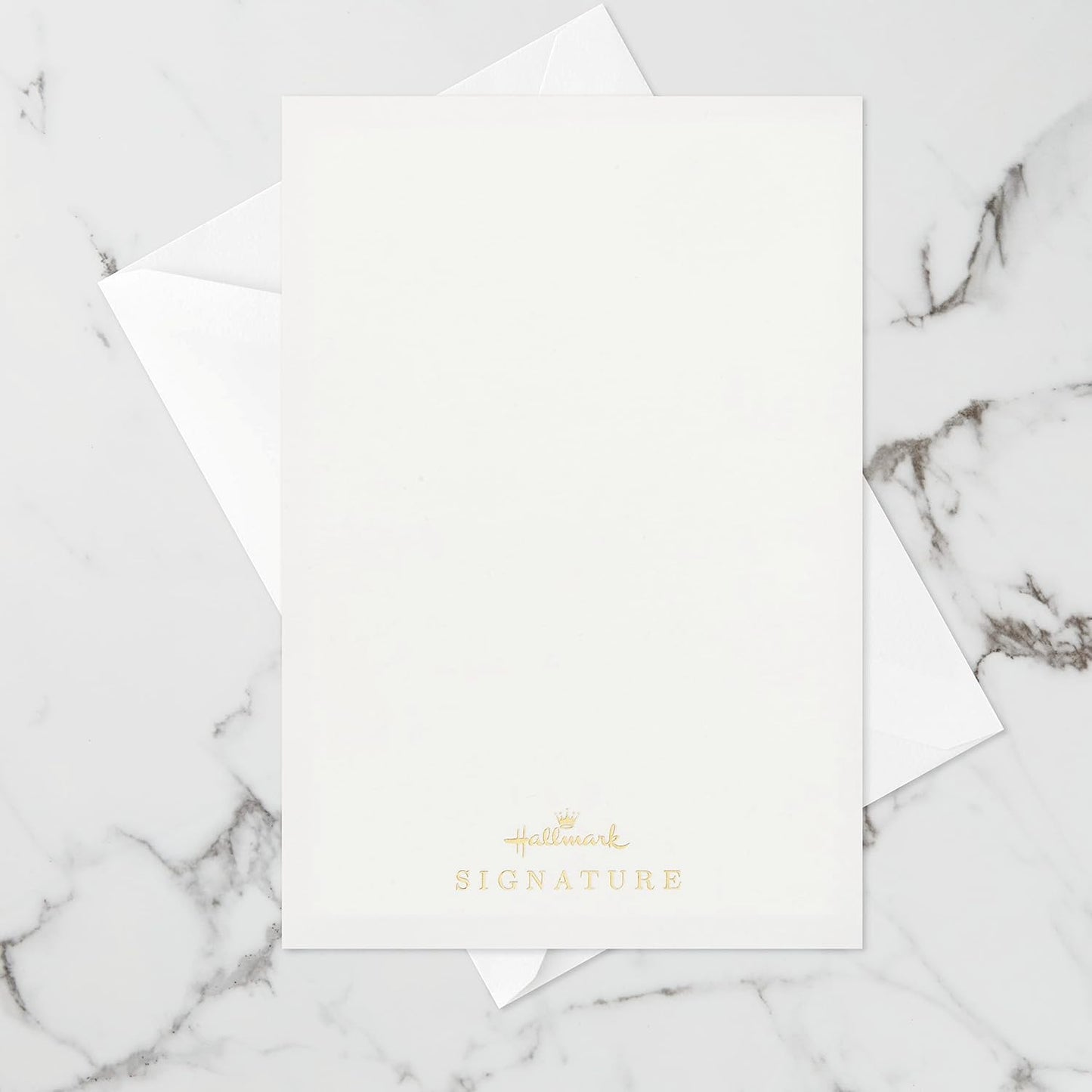 Hallmark Signature Paper Wonder Pop Up Birthday Card (Unicorn, You are Magical) flat lay on marble background with envelope.