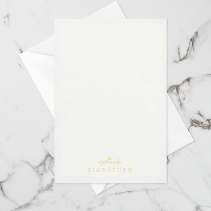 Hallmark Signature Paper Wonder Pop Up Birthday Card (Unicorn, You are Magical) flat lay on marble background with envelope.