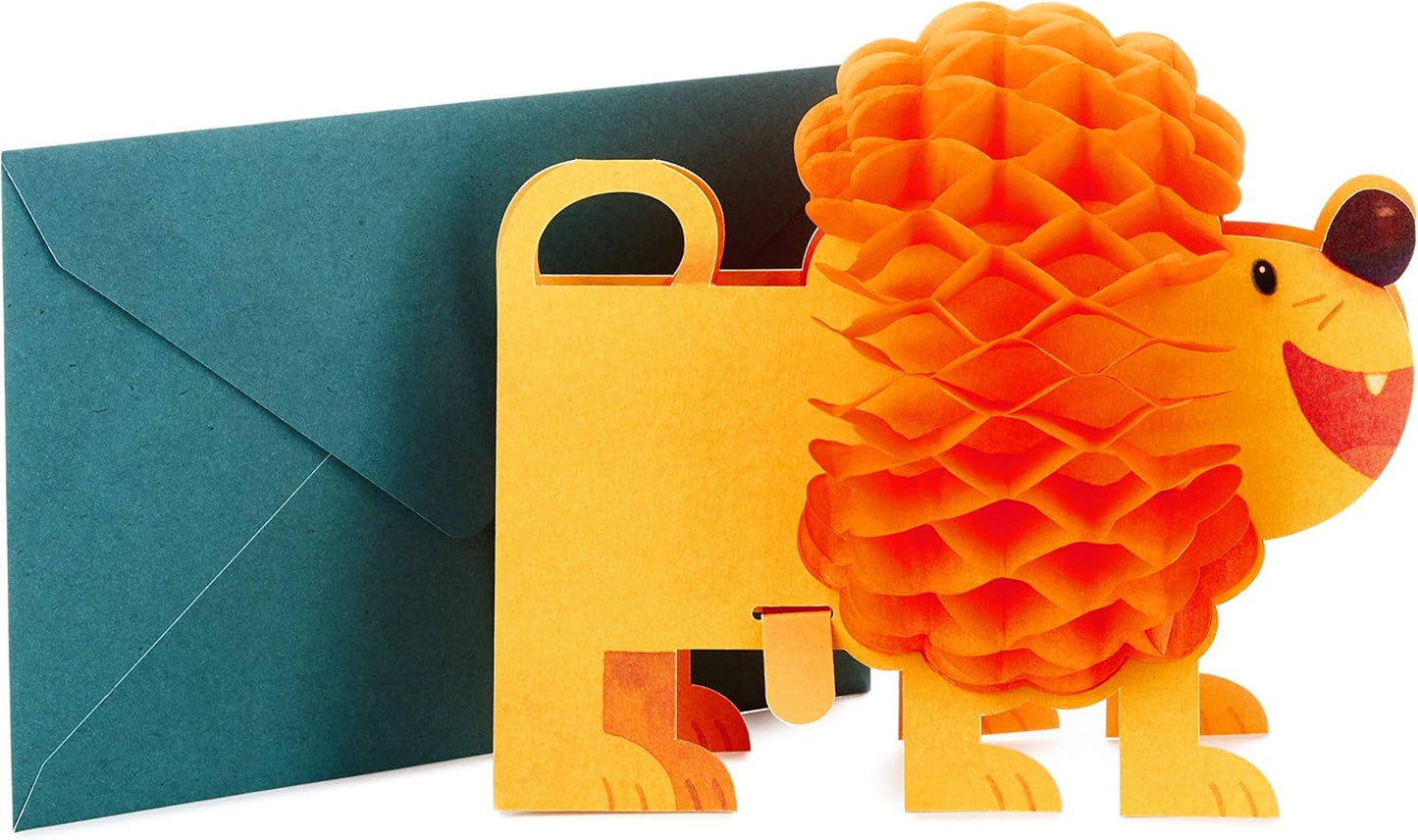 Hallmark Pop Up Birthday Card (3D Honeycomb Lion) with bright orange honeycomb mane and green envelope for festive birthday greetings.