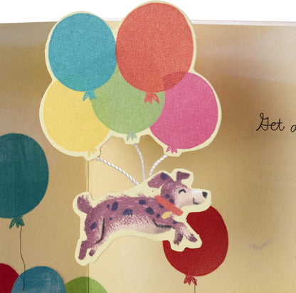 Hallmark Paper Wonder Pop Up Birthday Card (Get Carried Away) 3D dog illustration with colourful balloons in a pop-up design.
