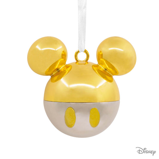 Hallmark Christmas Ornament (Disney Mickey Mouse Gold Icon Premium Metal) in shiny gold and white metal, featuring iconic Mickey ears, flat lay.