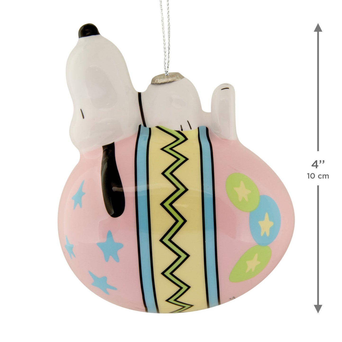 Decorative ornament of a dog character on a pink ball with colorful patterns, featuring a measurement indicator.