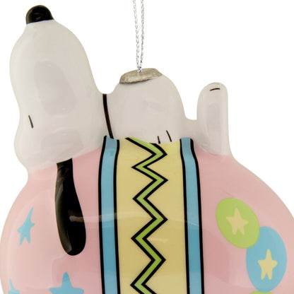 Decorative ornament of a dog character with a colorful pattern on a white background