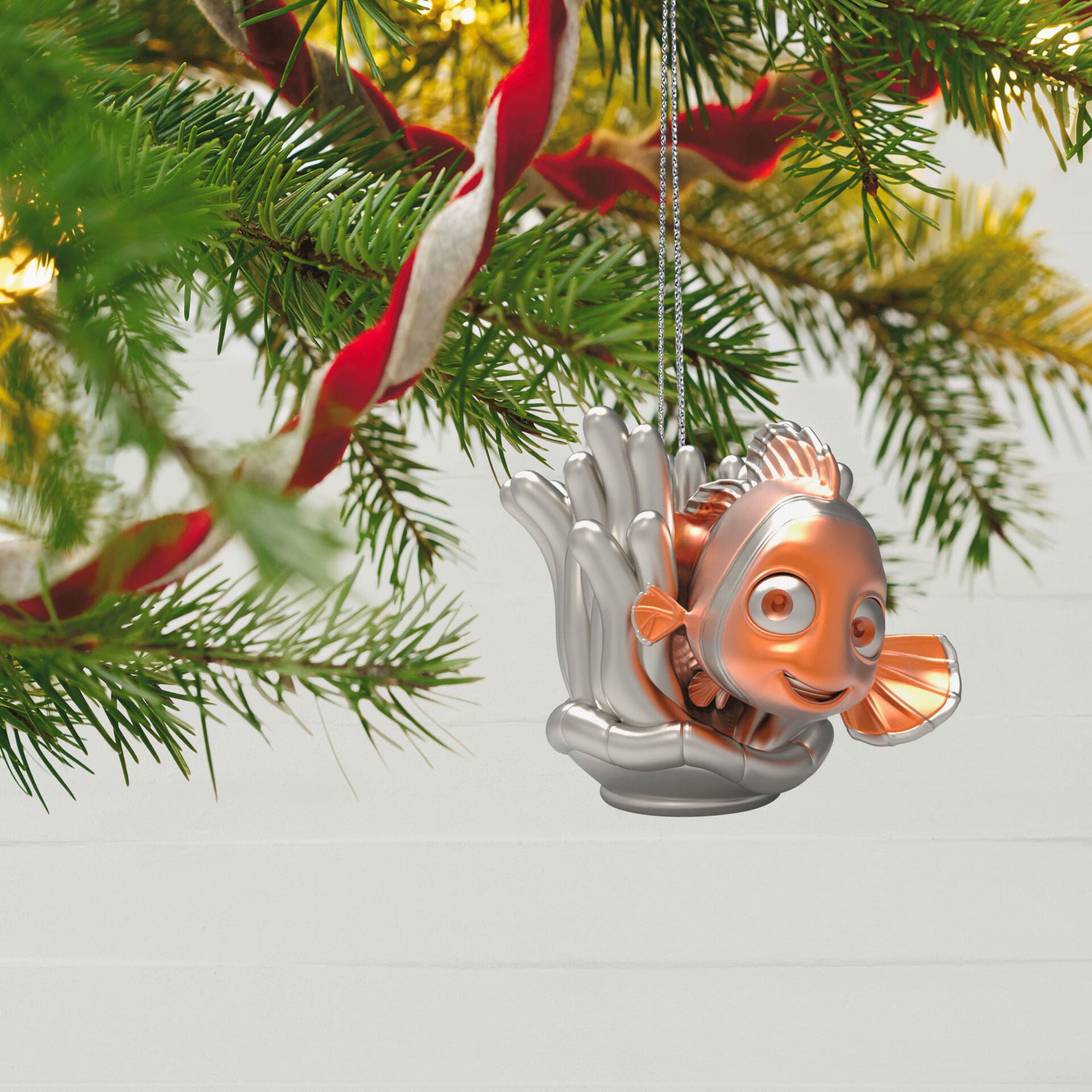 Disney 100 years of wonder Pixar and Princesses, set of 4 — Hallmark Keepsake Christmas ornament of Nemo from Finding Nemo, close up on tree