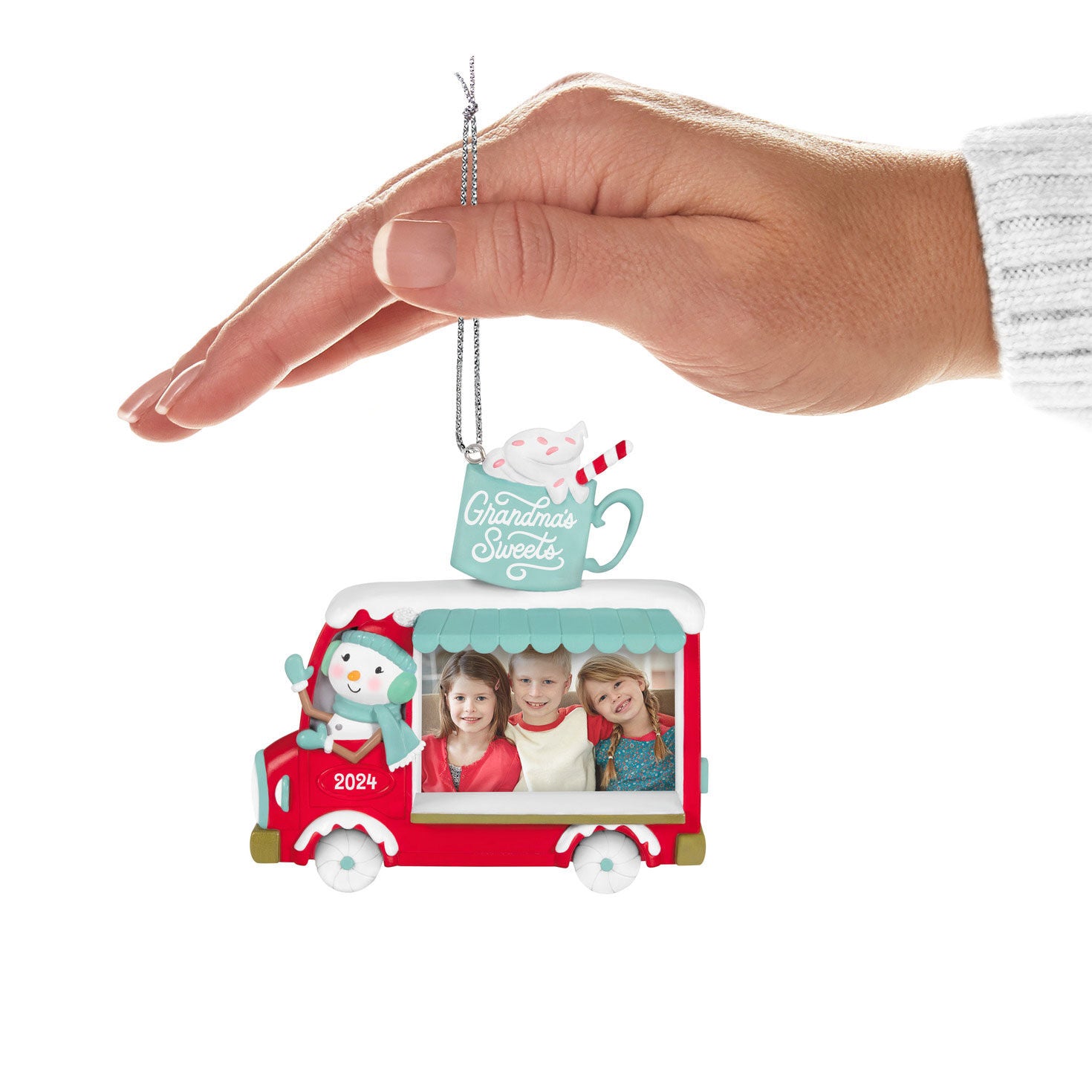 Grandma's Sweets Photo Frame — Hallmark Keepsake Christmas Ornament held in hand, featuring a snowman food truck and photo space.
