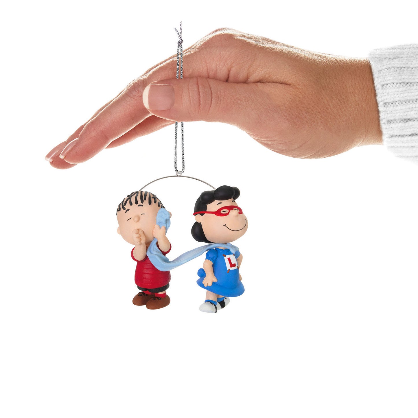 The Peanuts® Gang, Super Lucy and Linus — Hallmark Keepsake Christmas Ornament featuring Lucy as a superhero with Linus' blanket as a cape, being held.
