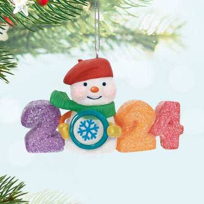Sweet Decade — 2024 Hallmark Keepsake Christmas Ornament featuring a glittery snowman holding a snowflake, colourful gumdrop numbers, close-up view.