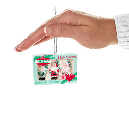 Nifty Fifties — Hallmark Keepsake Christmas Ornament featuring three vintage Santa ornaments in retro box, hand holding ornament.