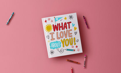 What I Love About You! A Color-Your-Own Recordable Storybook with colourful hand-drawn cover on a pink background, surrounded by crayons.