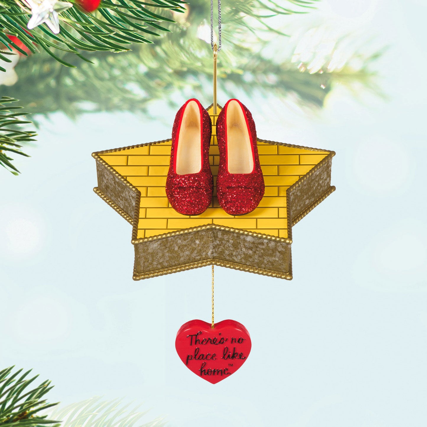 The Wizard of Oz™ There's No Place Like Home™ — Hallmark Keepsake Christmas Ornament featuring red ruby slippers on a star-shaped platform with a heart charm