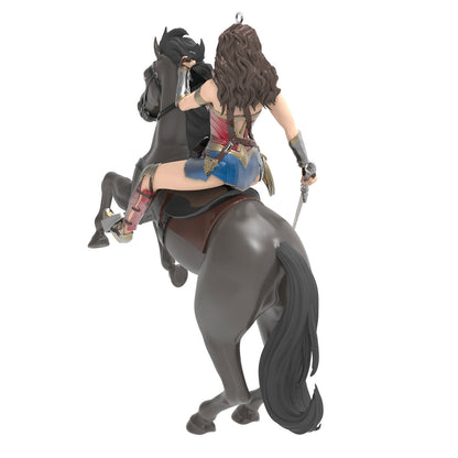 DC™ Wonder Woman™ — Hallmark Keepsake Christmas Ornament featuring the superhero riding a black horse, with her sword drawn, in action pose, back view.