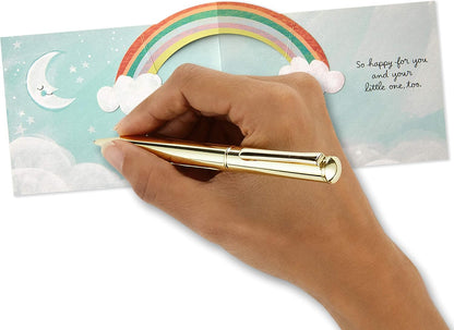 Hallmark Paper Wonder Pop Up Baby Shower Card (Sweet Dream Come True) with a hand writing inside, featuring a pop-up rainbow and clouds.