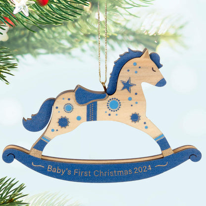 Baby Boy's First Christmas Rocking Horse Wood — Hallmark Keepsake Christmas Ornament, wooden decoration with blue and gold accents, hanging from a tree.