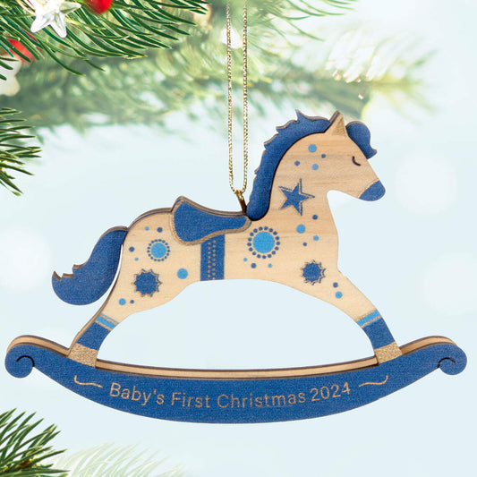 Baby Boy's First Christmas Rocking Horse Wood — Hallmark Keepsake Christmas Ornament, wooden decoration with blue and gold accents, hanging from a tree.