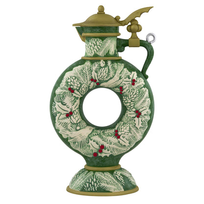 Beer Stein — 2025 Hallmark Keepsake Christmas Ornament, green ceramic with holly and evergreen wreath design, angled view