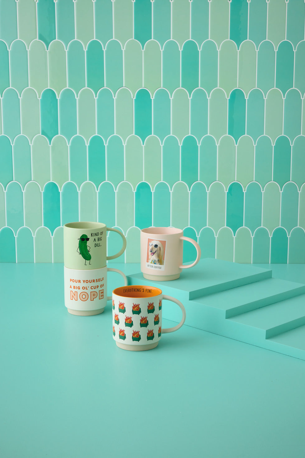 Before and after coffee funny mug, 16 oz., pink ceramic with dog photo, displayed on turquoise table with other mugs.