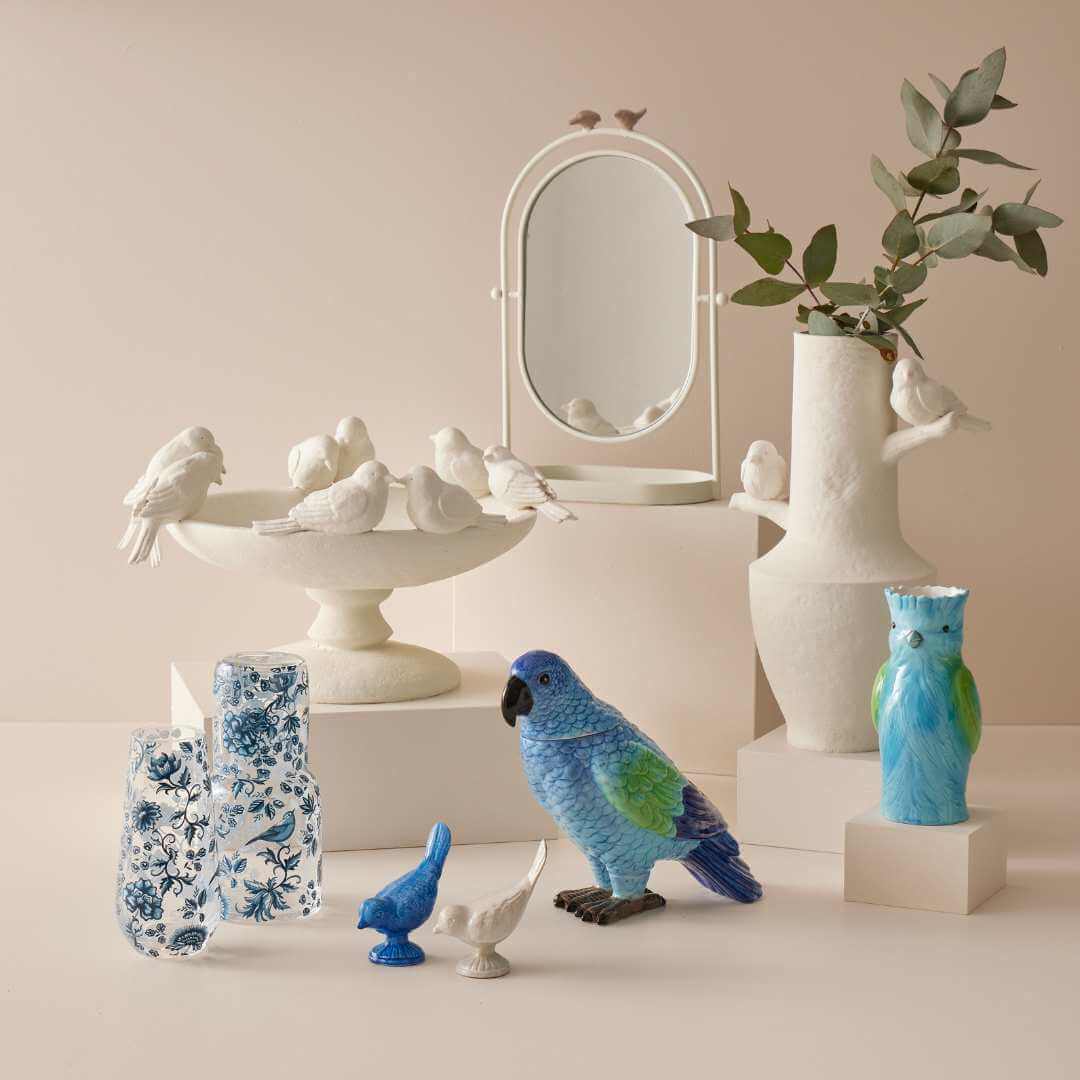 Bridie Vase - Blue displayed with ceramic birds and a vase in a neutral-tone setting, showcasing a decorative home decor arrangement.