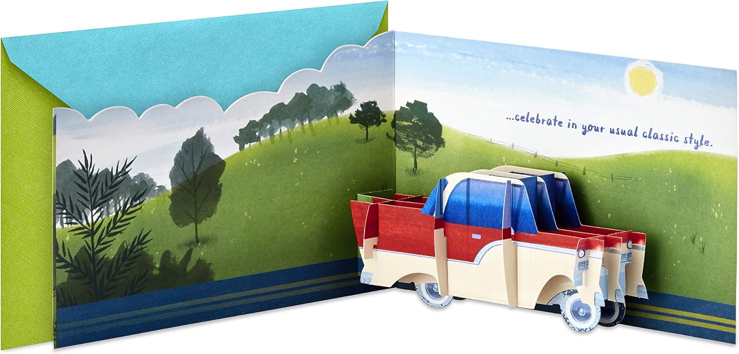 Hallmark Paper Wonder Displayable Pop Up Birthday Card (Classic Car) with a 3D pop-up truck design and vibrant landscape illustration.