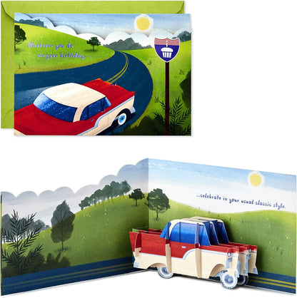 Hallmark Paper Wonder Displayable Pop Up Birthday Card (Classic Car) featuring a 3D pop-up classic car in a scenic landscape view.