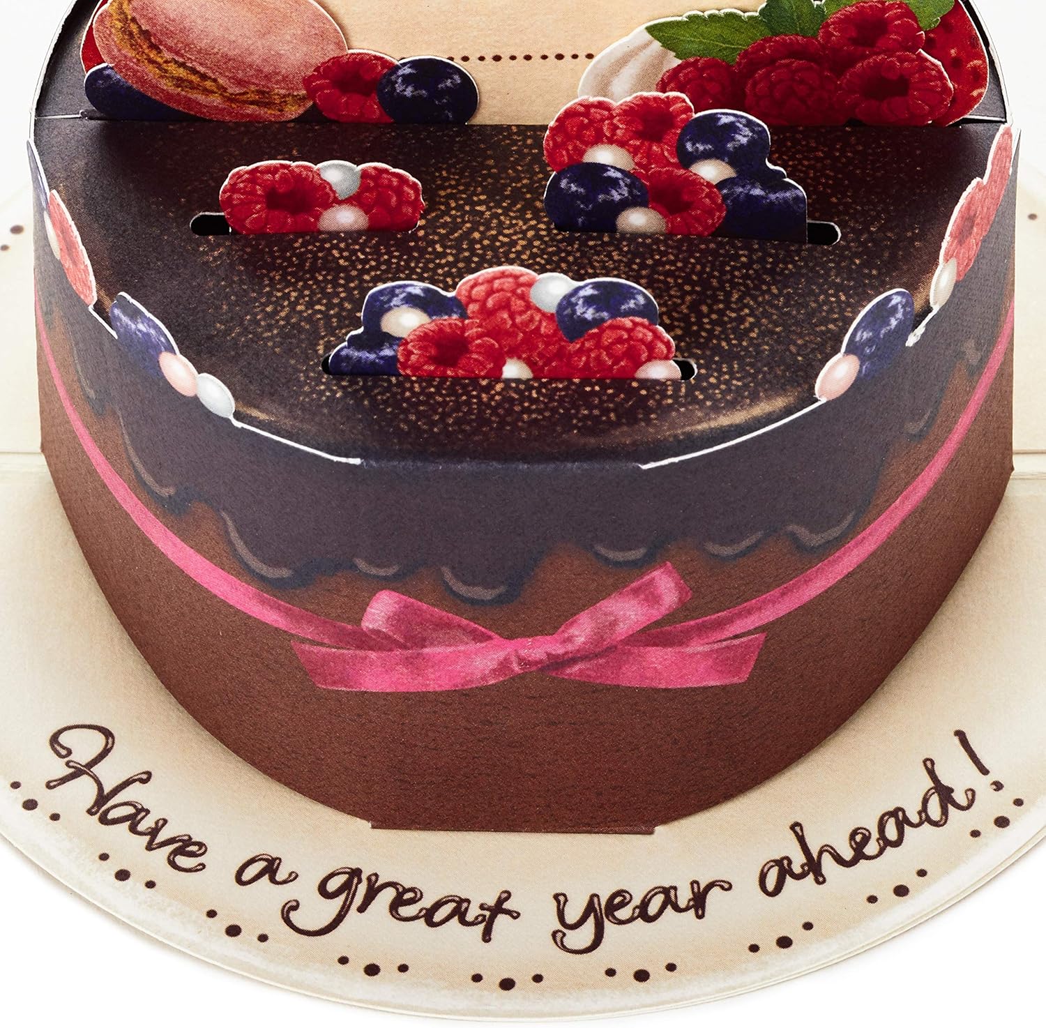 Hallmark Pop Up Birthday Card (Chocolate Cake) featuring a 3D chocolate cake design with berries and a pink ribbon, flat view.