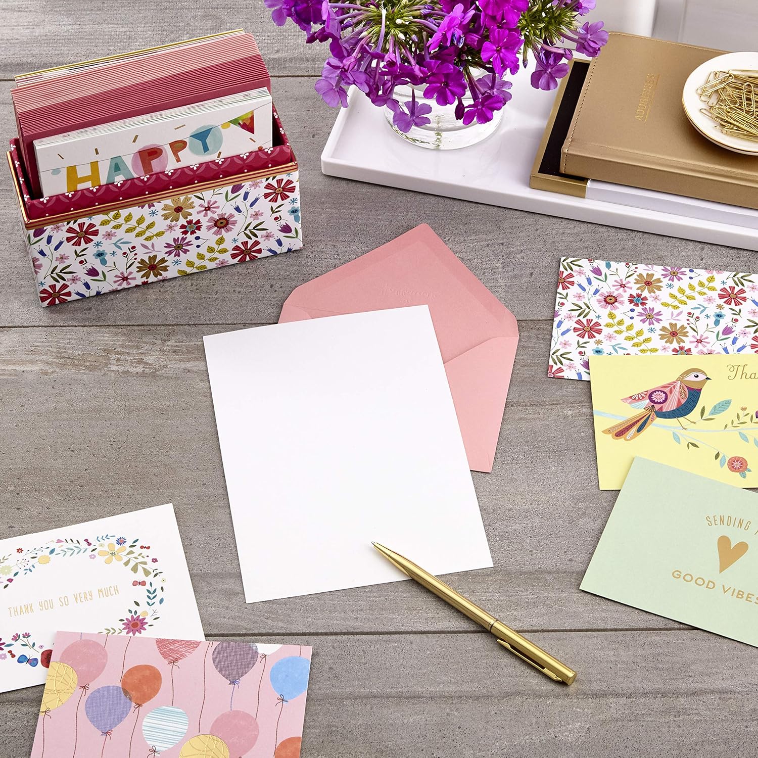 Hallmark Pack of 30 Assorted Boxed Greeting Cards, Good Vibes - Birthday Cards, Thinking of You Cards, Thank You Cards, Blank Cards with decorative envelopes and a blank card on a wooden table.