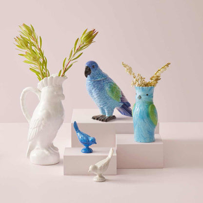 Bridie Vase - Blue, ceramic bird-shaped vase with dried flowers, displayed alongside other decorative bird vases and accessories.